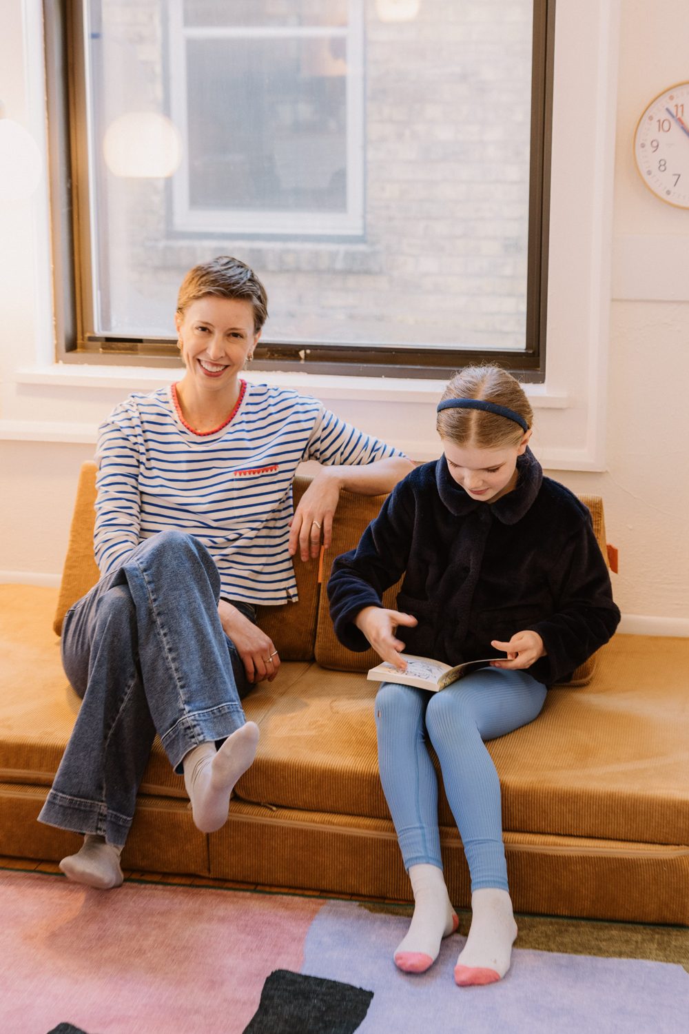 Reading together on the corduroy couch
