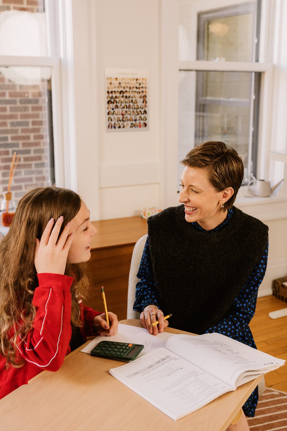 Mid-laugh over math with a teen